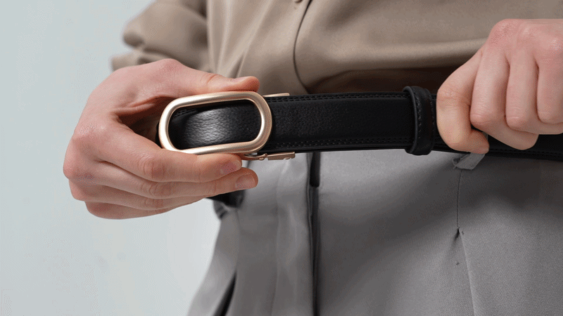 Solenna belt straps in black, brown, and tan showing the ratchet track design